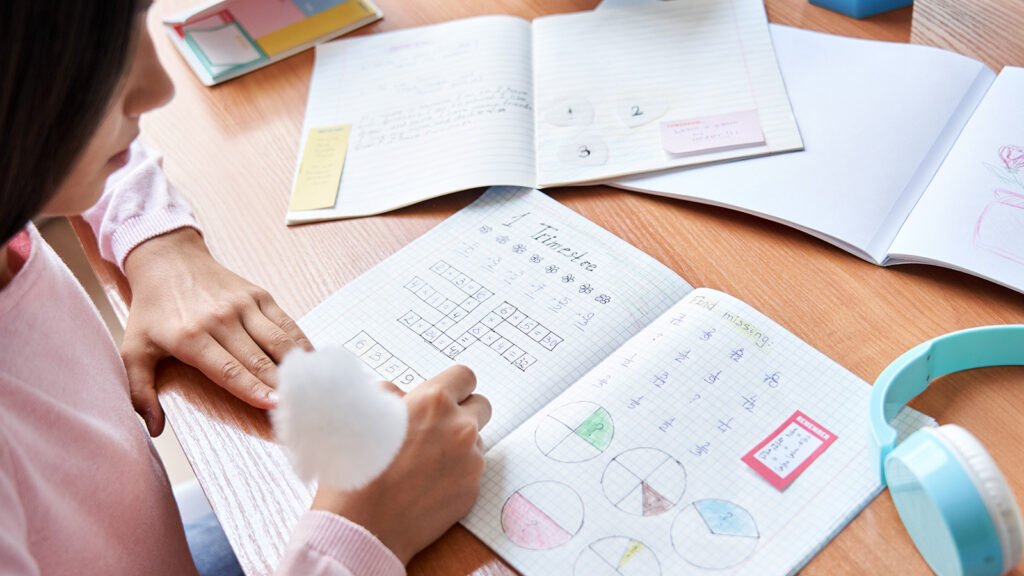 Student learning mathematics through independent study and problem-solving.